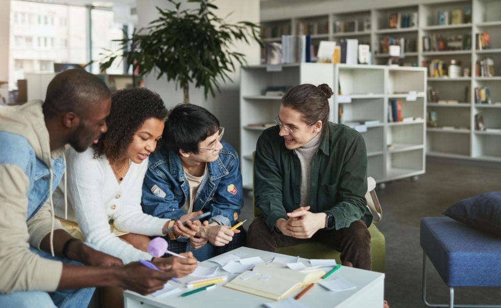 Students meeting at a desk in the library.