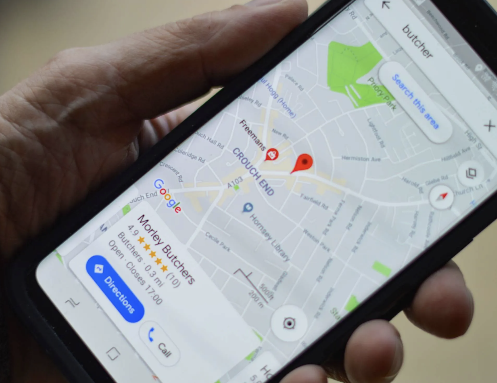 A top-down shot of a phone using Google Maps to navigate to a location