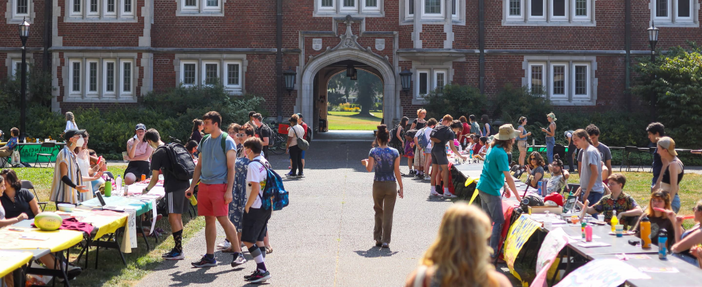 An image that shows students attending a club fair on campus.