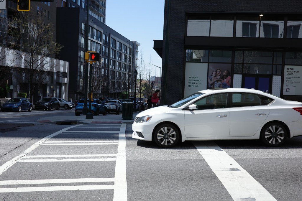 This image shows the effect of a fast shutter speed. Captured in the middle of motion, the car is clear with no blur.
