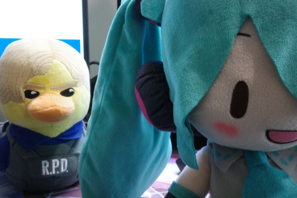 This photo shows the effect of a narrower aperture with a deeper depth of field. Both dolls in the image are in focus.