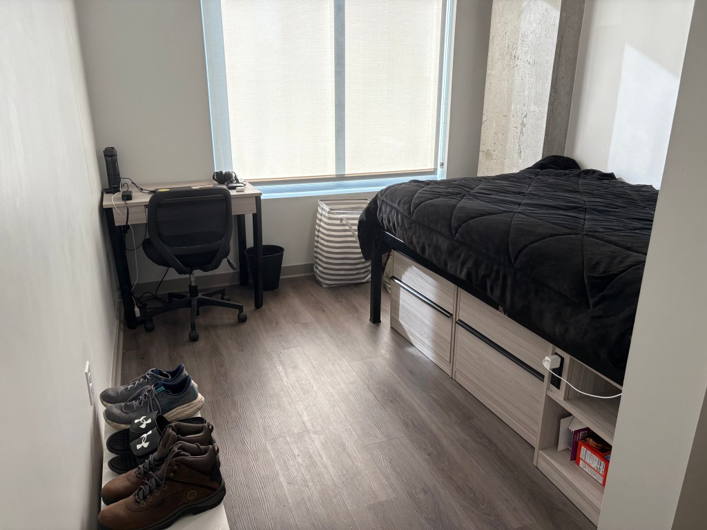 A cleaned bedroom that has been nicely organized.