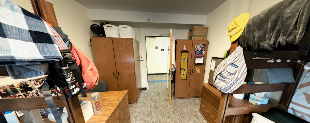 A slideshow carousel of different views of a Towers' dorm room setup.