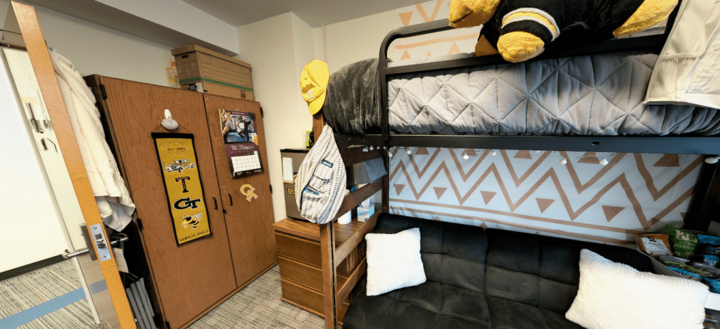 A slideshow carousel of different views of a Towers' dorm room setup.