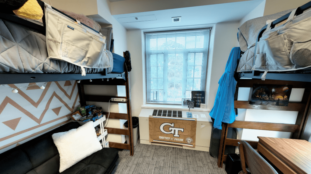 A slideshow carousel of different views of a Towers' dorm room setup.