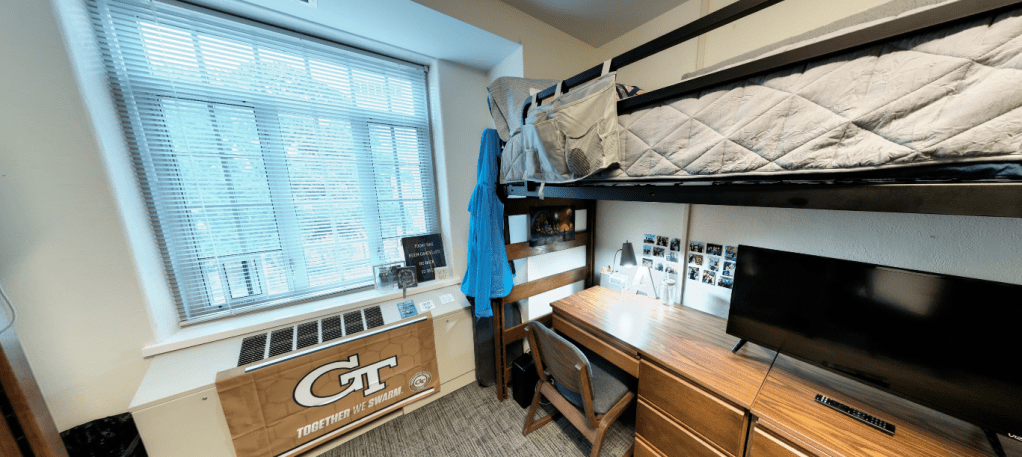 A slideshow carousel of different views of a Towers' dorm room setup.