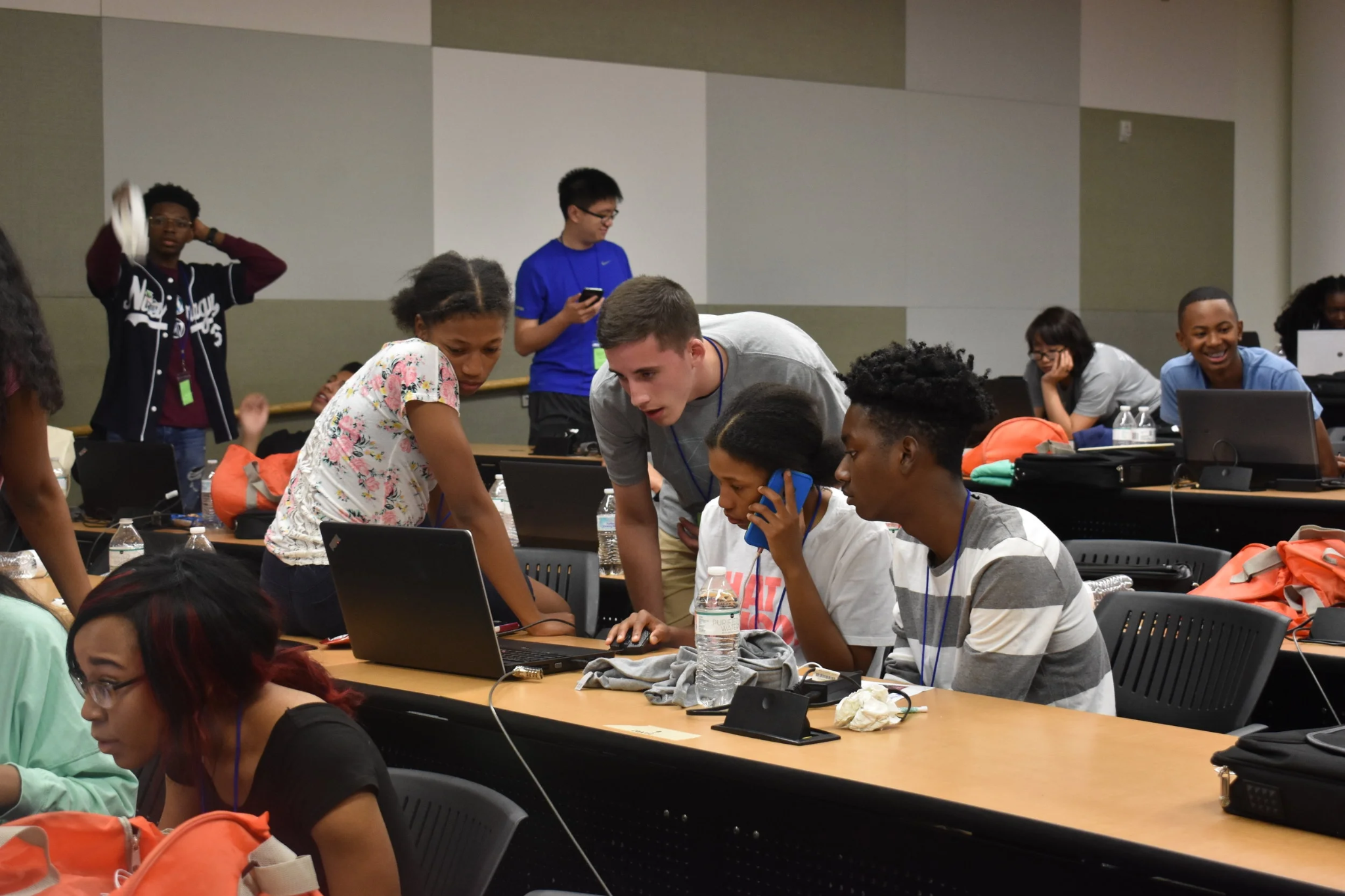 Students gather around laptops and collaborate on a project during HackGT, a major Georgia Tech hackathon.